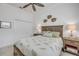 Bedroom with a queen-sized bed, ceiling fan, and a closet at 3017 Glin Cir, Ormond Beach, FL 32174