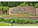 Welcome to Halifax Plantation: A distinguished brick sign with manicured landscaping, setting an elegant tone at 3017 Glin Cir, Ormond Beach, FL 32174