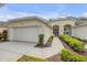Inviting home exterior with manicured landscaping and a walkway leading to the front door at 3017 Glin Cir, Ormond Beach, FL 32174