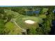 Scenic golf course view with lush green fairways, sand trap, and water features, offering a picturesque golfing experience at 3017 Glin Cir, Ormond Beach, FL 32174