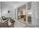 Enclosed lanai features wicker furniture and large sliding glass doors leading to the living room at 3017 Glin Cir, Ormond Beach, FL 32174