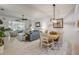 Inviting living room with comfortable seating, tiled floors, and sliding doors to the patio at 3017 Glin Cir, Ormond Beach, FL 32174