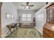 Office space with a desk, loveseat, and closet for extra storage at 3017 Glin Cir, Ormond Beach, FL 32174