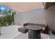 Spacious balcony with comfortable seating, a fire pit table, and a sunshade for outdoor enjoyment at 308 N Shadowbay Blvd # 214, Longwood, FL 32779
