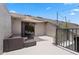 Private balcony featuring outdoor seating and a sunshade, creating a perfect relaxation spot at 308 N Shadowbay Blvd # 214, Longwood, FL 32779