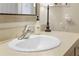 Close up of a well-lit bathroom sink with modern faucet and decorative hand soap, creating a clean and inviting space at 308 N Shadowbay Blvd # 214, Longwood, FL 32779