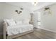 Bright bedroom featuring wood floors, a comfortable daybed, and stylish decor, creating a cozy retreat at 308 N Shadowbay Blvd # 214, Longwood, FL 32779