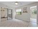 Bright bedroom featuring a sliding glass door and neutral decor with a ceiling fan and a plush rug at 308 N Shadowbay Blvd # 214, Longwood, FL 32779