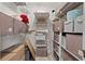 Organized closet with shelving units filled with boxes and storage containers, creating a tidy and efficient space at 308 N Shadowbay Blvd # 214, Longwood, FL 32779