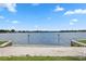 Community beach with shallow water, lake view and manicured landscaping at 308 N Shadowbay Blvd # 214, Longwood, FL 32779