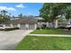 Inviting townhome featuring attached garages and a well manicured lawn at 308 N Shadowbay Blvd # 214, Longwood, FL 32779