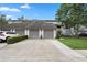 Charming townhouse with attached garages and landscaped front yard at 308 N Shadowbay Blvd # 214, Longwood, FL 32779
