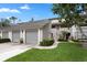Inviting townhome with attached garage and landscaped front yard at 308 N Shadowbay Blvd # 214, Longwood, FL 32779