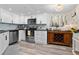 Modern kitchen with stainless steel appliances and sleek countertops at 308 N Shadowbay Blvd # 214, Longwood, FL 32779