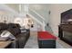 Comfortable living room with staircase, modern TV, and inviting fireplace at 308 N Shadowbay Blvd # 214, Longwood, FL 32779