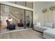 Bright living room showcasing high ceilings, staircase, and sliding glass doors to the lanai at 308 N Shadowbay Blvd # 214, Longwood, FL 32779