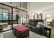 Open living area with modern furniture, high ceilings, and scenic views from a lanai at 308 N Shadowbay Blvd # 214, Longwood, FL 32779
