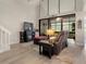 Spacious living room with natural light, fireplace, and sliding glass doors to a lanai at 308 N Shadowbay Blvd # 214, Longwood, FL 32779