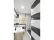 Modern bathroom with stylish tile, black fixtures, and walk-in shower at 320 Eaton St, Maitland, FL 32751