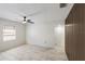 Bedroom with a ceiling fan, tile flooring, and accent wall, offering a serene and modern living space at 320 Eaton St, Maitland, FL 32751