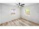 This bedroom features new vinyl flooring and a ceiling fan with attached lighting at 320 Eaton St, Maitland, FL 32751