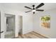 Bedroom featuring vinyl flooring, a storage closet, and access to laundry at 320 Eaton St, Maitland, FL 32751