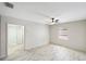 Bedroom view showing vinyl flooring, a window, and access to the hallway at 320 Eaton St, Maitland, FL 32751