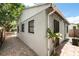 Home exterior featuring a secure iron gate, well-maintained yard, and decorative stone walkway at 320 Eaton St, Maitland, FL 32751