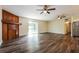 Living room features hardwood floors, a decorative wood fireplace, and a glass sliding door at 3312 Victory Palm Dr, Edgewater, FL 32141