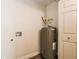 Utility closet with a hot water heater and connections for a washer and dryer at 3312 Victory Palm Dr, Edgewater, FL 32141