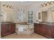 Elegant bathroom with dual vanities, a soaking tub, and tasteful decor at 336 Highcroft Ct, Lake Mary, FL 32746