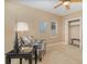 Bright bedroom featuring a comfortable chair, window with blinds, and a closet at 336 Highcroft Ct, Lake Mary, FL 32746