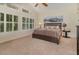 Comfortable bedroom with vaulted ceiling, large windows, and neutral decor at 336 Highcroft Ct, Lake Mary, FL 32746
