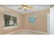 Bright bedroom with a ceiling fan, neutral paint, a window letting in natural light, and a closet at 336 Highcroft Ct, Lake Mary, FL 32746