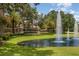 Beautiful gated community entrance with water fountains and lush landscaping at 336 Highcroft Ct, Lake Mary, FL 32746