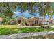 Charming single-story home with beautiful landscaping, mature trees, and a tile roof at 336 Highcroft Ct, Lake Mary, FL 32746