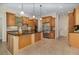 Spacious kitchen featuring wood cabinetry, granite countertops, stainless steel appliances, and a large center island at 336 Highcroft Ct, Lake Mary, FL 32746
