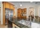 Bright kitchen featuring granite countertops, stainless steel appliances, and custom cabinetry at 336 Highcroft Ct, Lake Mary, FL 32746