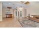 Spacious living room with decorative ceiling, tiled floor, bar and entry at 336 Highcroft Ct, Lake Mary, FL 32746