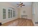 Office with hardwood floors, shuttered windows, and a modern table at 336 Highcroft Ct, Lake Mary, FL 32746