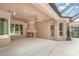 Spacious outdoor patio featuring a fireplace, ceiling fans, and access to the pool area at 336 Highcroft Ct, Lake Mary, FL 32746