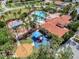 Aerial shot of the community's layout, featuring homes, green spaces, and a central pool area with a playground at 3640 Sail Harbor Dr, Kissimmee, FL 34746