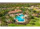 Panoramic aerial view of a community's resort-style pool area, showcasing ample seating and recreation spaces at 3640 Sail Harbor Dr, Kissimmee, FL 34746