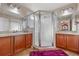 Well-lit bathroom with a glass-enclosed shower, dual sinks, and modern fixtures at 3640 Sail Harbor Dr, Kissimmee, FL 34746