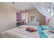 bedroom with a bed, bookshelf, and dresser at 3640 Sail Harbor Dr, Kissimmee, FL 34746