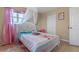 Comfortable bedroom with a bed featuring a white headboard and sheer canopy at 3640 Sail Harbor Dr, Kissimmee, FL 34746