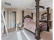 Spacious bedroom featuring a four-poster bed, ceiling fan, and ample natural light at 3640 Sail Harbor Dr, Kissimmee, FL 34746