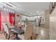 Open-concept dining area flowing into a bright kitchen with white cabinets and stainless steel appliances at 3640 Sail Harbor Dr, Kissimmee, FL 34746