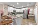 Bright kitchen with white cabinets, stainless steel appliances, granite countertops, and bar seating at 3640 Sail Harbor Dr, Kissimmee, FL 34746