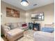 Cozy living room featuring plush furniture, a decorative fireplace, and warm neutral tones at 3640 Sail Harbor Dr, Kissimmee, FL 34746